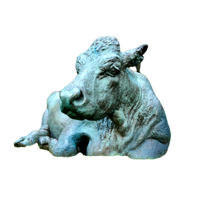 A Statue Of A Cow Sitting In The Grass – cat PNG with transparent background